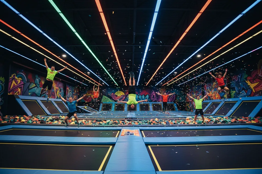 Jumpers on neon trampoline courts